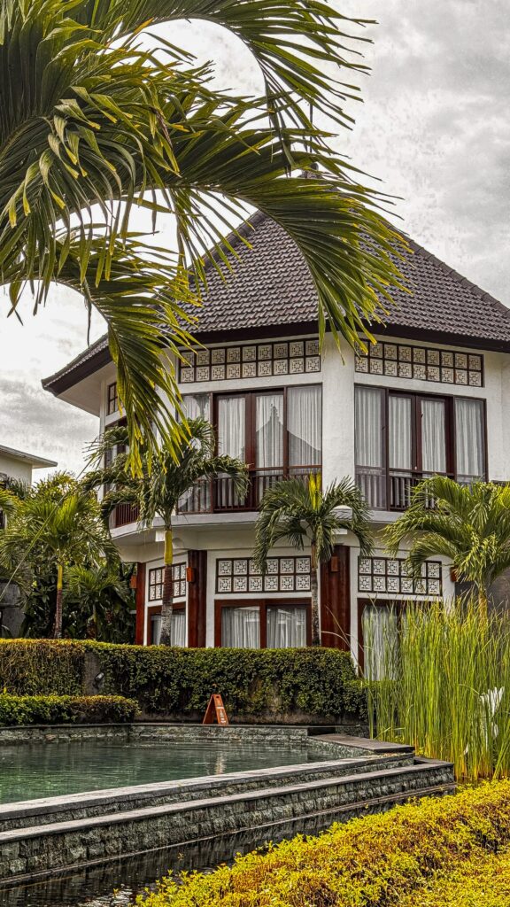 Elegant Balinese villa with tropical garden and pool, perfect for a luxury retreat.
